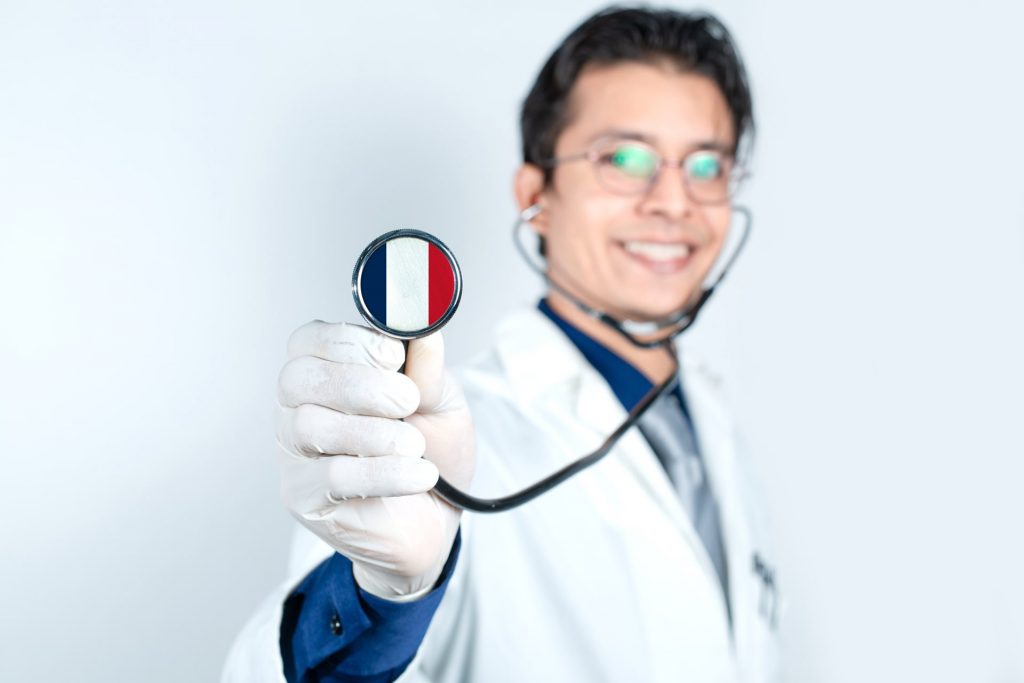 A doctor holding a stethoscope that shows the french glaf